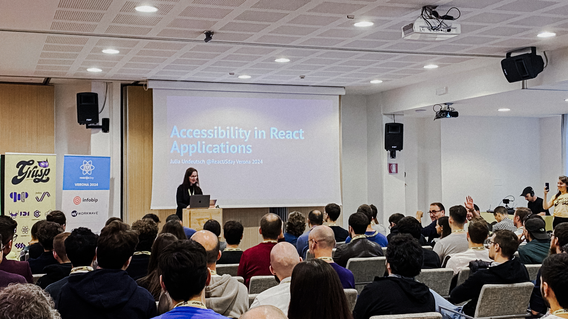 People attending the conference Accessibility in React applications