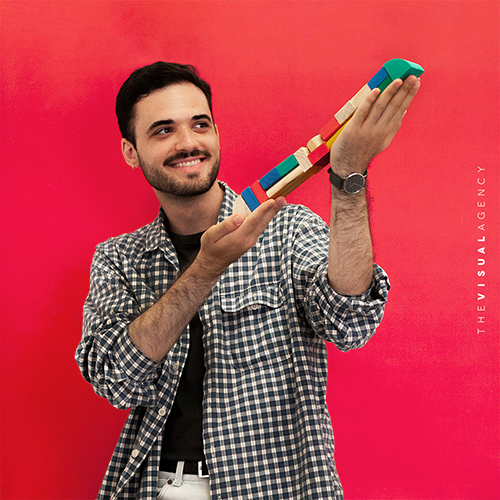 André Calderolli is a Digital Designer. He is dreamily looking at the wooden train in his hands for his next adventure.