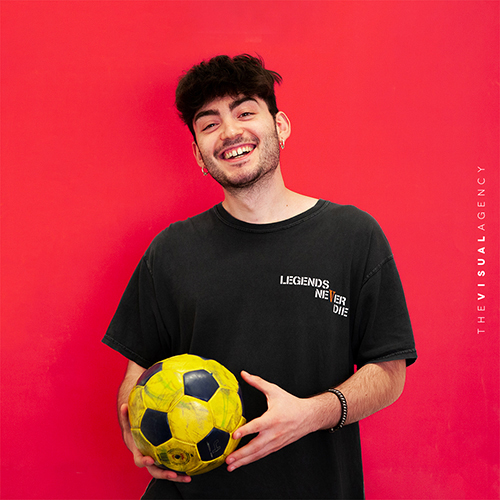 Matteo Direnzo is a Front-end Developer. He is holding a soccer ball, ready for a quick CSS match.