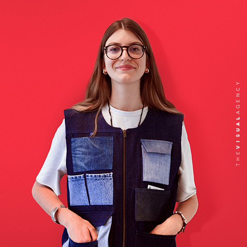 Eugenia Garavaglia is the Information Designer. She is wearing a gilet with numerous pockets, as if each one holds a perfectly visualized data set.