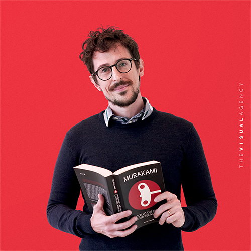 Luca Gilioli is the PMO Lead. He delves into a book, probably managing projects one poetic metaphor at a time.